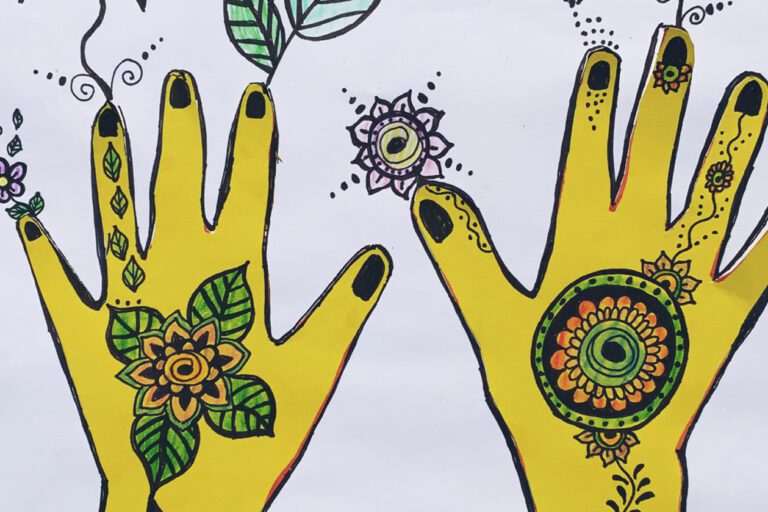 Child's drawing of henna patterns on a pair of hands. The hands are yellow against a white background.